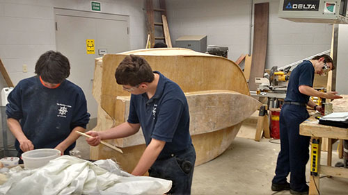 Cadets gain valuable hands-on experience in applying boat-building and woodworking skills in our boat-building lab.
